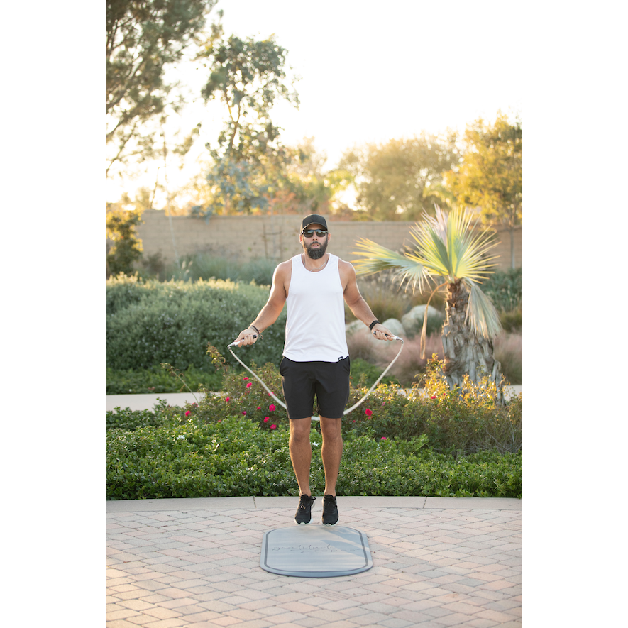 Person using the Elite Weighted Jump Rope Set during a full-body fitness workout, building strength, stamina, and endurance